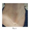 Collana ali in oro indossata
