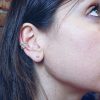 Orecchino Ear cuff in argento dorato con zirconi