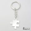 portachiavi a forma di puzzle in argento 925 con incisione
