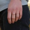 Anello di sfere in oro rosa e perla centrale