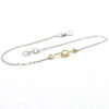 bracciale in oro bianco con centrale nodo in oro giallo a filo