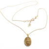 Collana in argento dorato con Madonna e simboli sacri