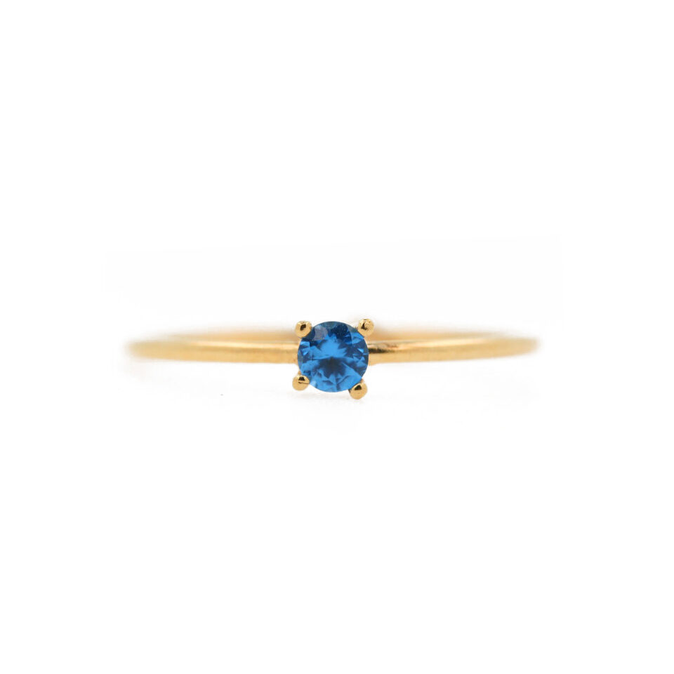 solitario in oro e zircone azzurro