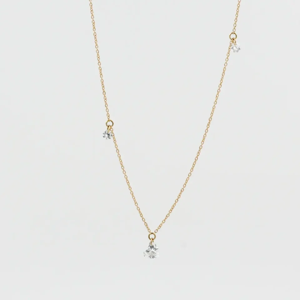 Collana Diamanti Nudi in oro giallo 18 kt con diamante taglio cuore e diamanti taglio brillante