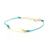 bracciale in oro con piastrina e cordino cerato azzurro