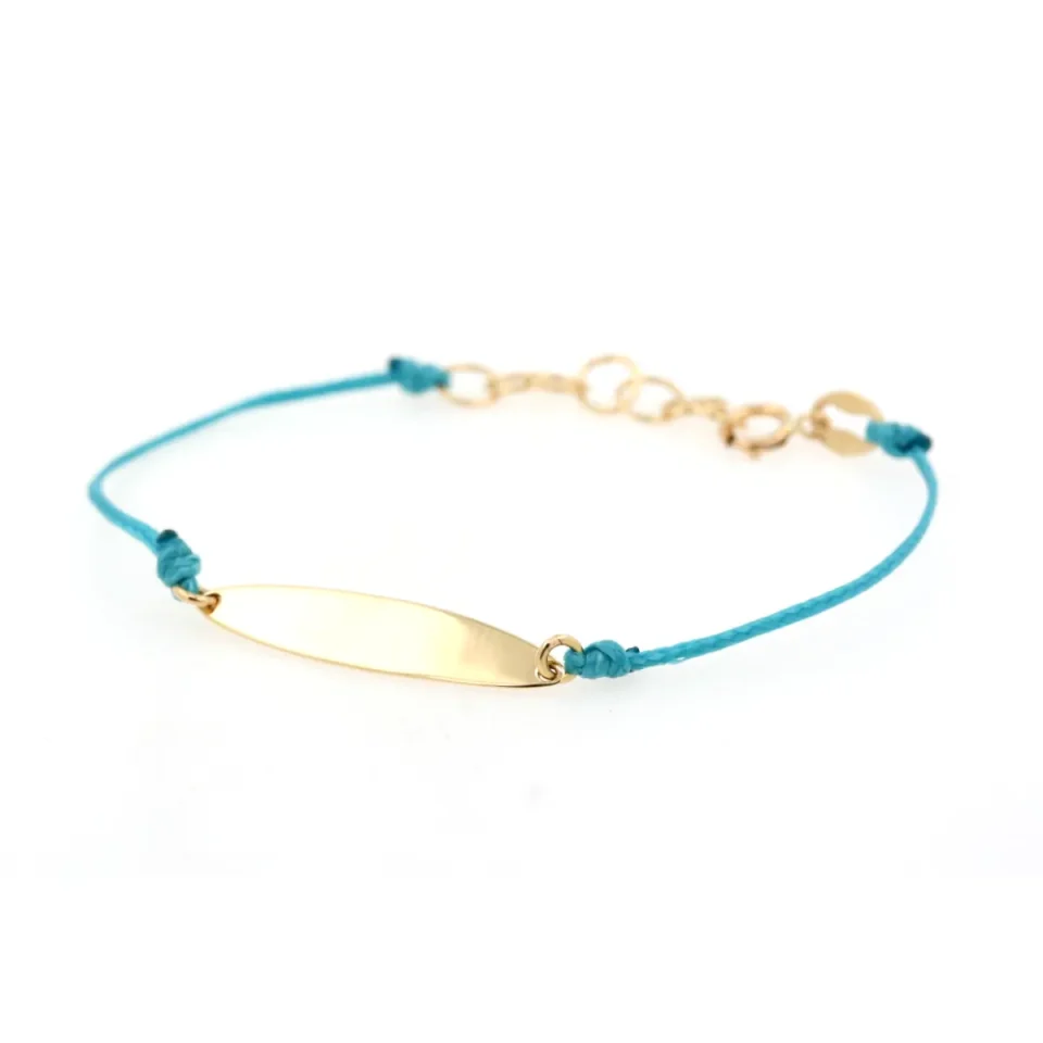 bracciale in oro con piastrina e cordino cerato azzurro